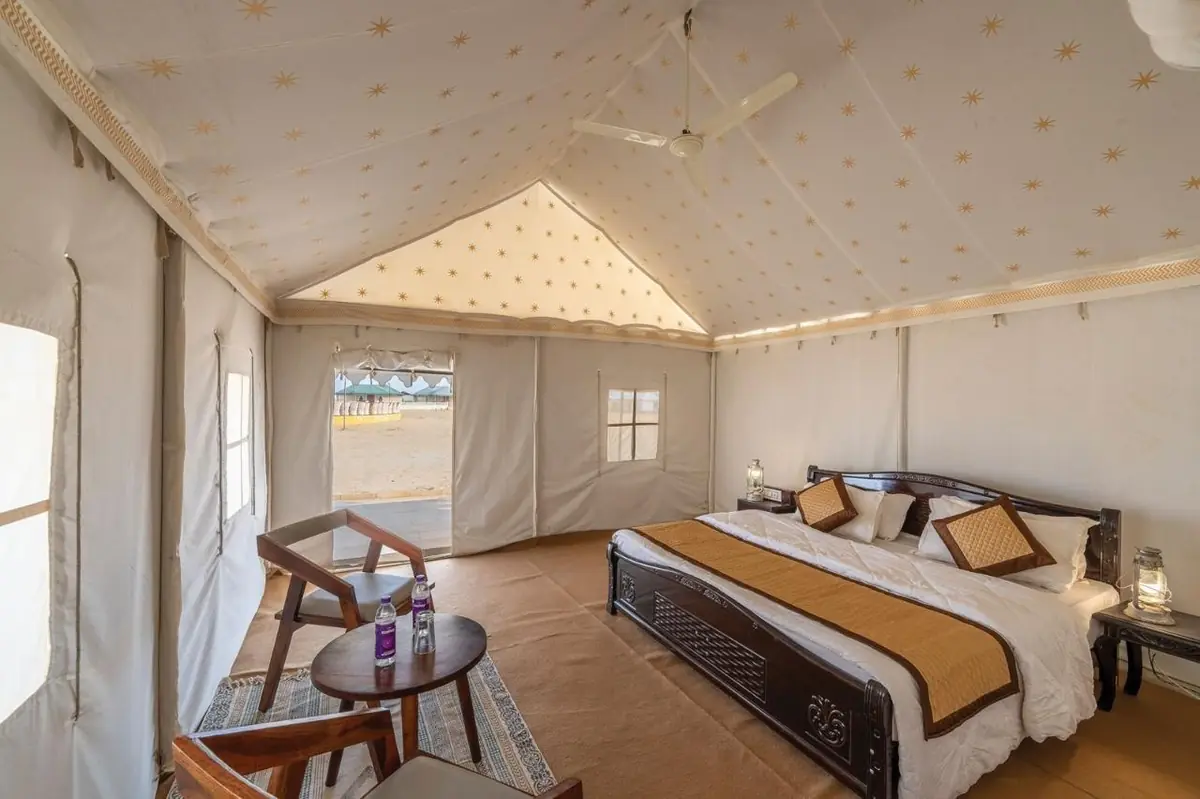 Inside a semi-luxury Swiss tent with seating and window